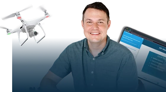 Man with drone and tablet, smiling at camera.
