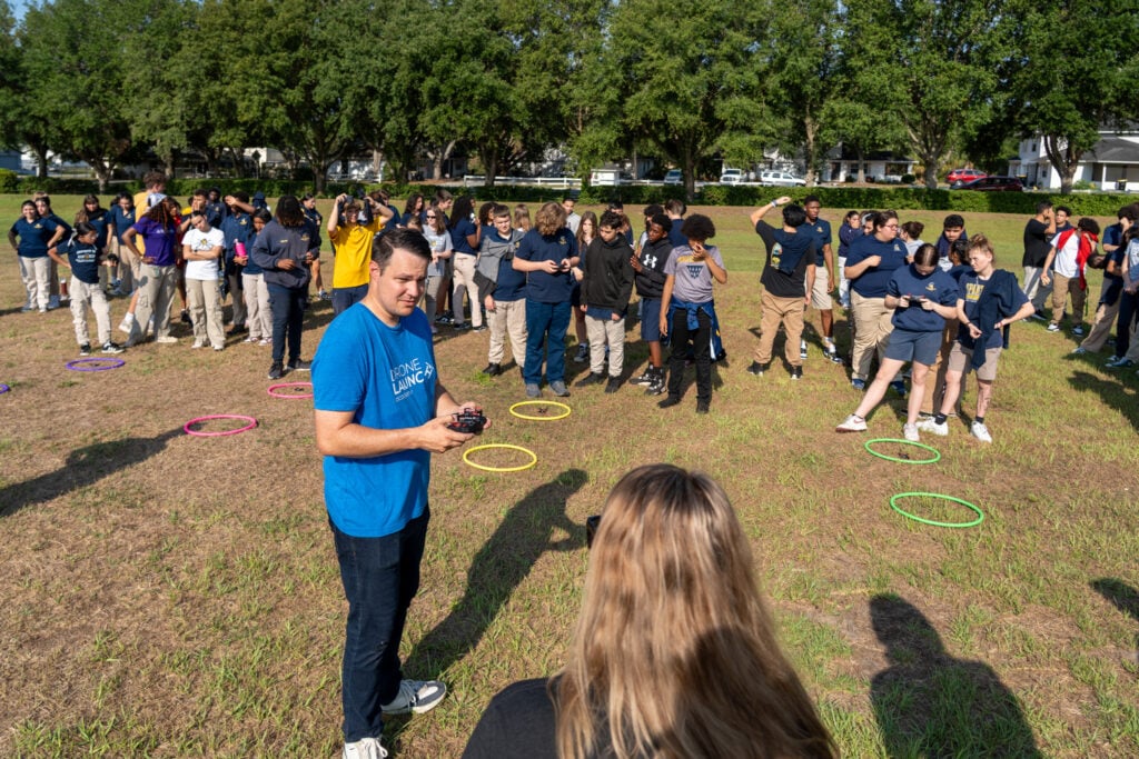 Group of students preparing for outdoor drone exercise.