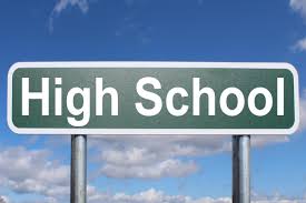 High school sign with blue sky background